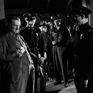 BORDER INCIDENT, from left: Sig Ruman (far left), George Murphy (center, black leather jacket, holding cigarette), 1949
