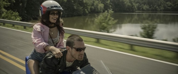 Camila (Maia Reficco) and Wes (K. J. Apa) go for a spin, in "One Fast Move." (Amazon Prime Video)