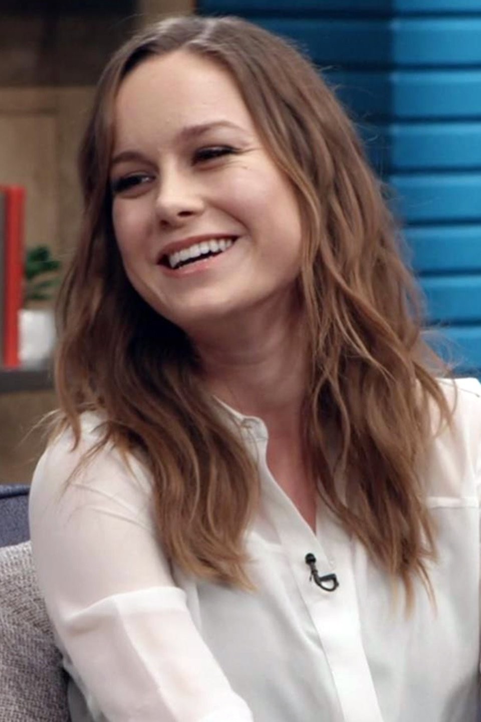 Brie Larson Wears A Billowy Long Sleeve Shirt And White Saddle Shoes