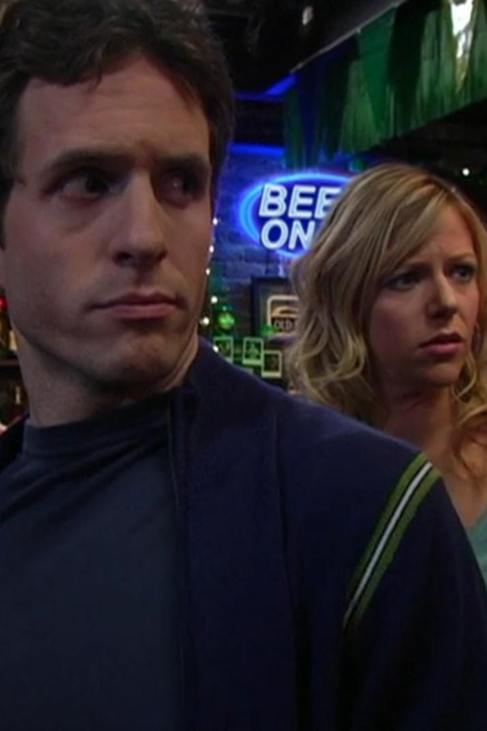 Season 1 episode still from It's Always Sunny in Philadelphia featuring Glenn Howerton as Dennis Reynolds and Kaitlin Olson as Dee Reynolds in Paddy's Pub.