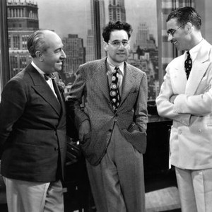 BLONDE TROUBLE, director George Archainbaud (l.), writer George S. Kaufman (c.), director Frank Tuttle (r.) on set, 1937