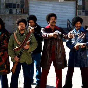 BLACK DYNAMITE, Tommy Davidson (far left), Darrel Heath (second from left), Michael Jai White (two pistols, center), Phil Morris (far right), 2009. ph: Prashant Gupta/©Apparition