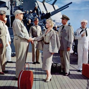 DON'T GO NEAR THE WATER, shaking hands from left: Howard Smith, Eva Gabor, Glenn Ford (second from right), 1957