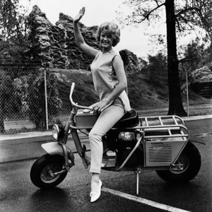 SPENCER'S MOUNTAIN, Mimsy Farmer, on a Cushman Trailster scooter, 1963