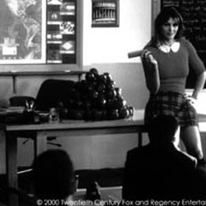 The mischievous Devil (ELIZABETH HURLEY) assigns to her class some unusual homework assignments. photo 9