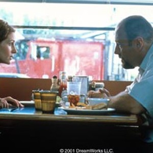 Samantha (JULIA ROBERTS) begins to bond with the hit man Leroy (JAMES GANDOLFINI) who has taken her hostage in order to insure her boyfriend's return with an antique pistol known as The Mexican.