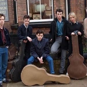 NOWHERE BOY, Thomas Sangster (left of center), Aaron Johnson (right of center), director  Sam Taylor Wood (second from right), on set, 2009. ph: Liam Daniel/©Weinstein Company