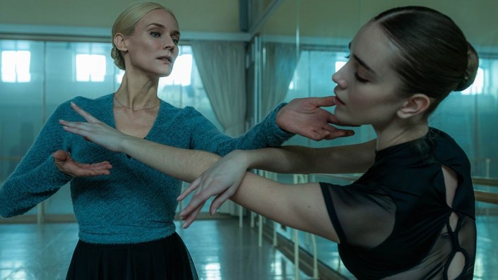 Ballet instructor Tatiyana Volkova (Diane Kruger, L) gives Joy Womack (Talia Ryder) a posture adjustment, in "The American." (Ingenious Media)