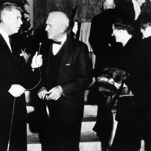 TENDER IS THE NIGHT, director Henry King (bowtie) being interviewed at movie premiere, 1962, TM & Copyright © 20th Century Fox Film Corp.