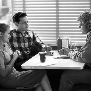 PLEASANTVILLE, Director, Gary Ross, discussing a scene with Reese Witherspoon & Tobey Maguire, 1998.