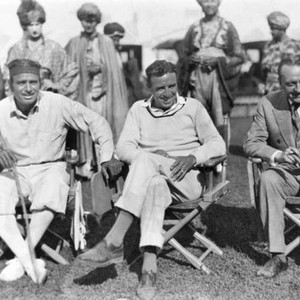 THE THIEF OF BAGDAD, Douglas Fairbanks, Sr. (left), director Raoul Walsh (center), on set, 1924
