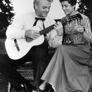 TRIBUTE TO A BAD MAN, James Cagney playing the guitar for Irene Papas on set, 1956