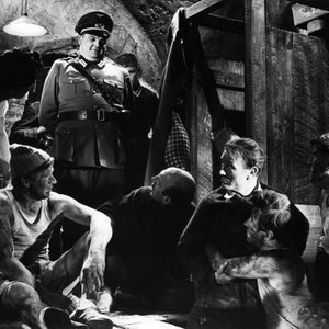 THE COLDITZ STORY, Denis Shaw (in uniform), looking back from left: Lionel Jeffries, John Mills, Bryan Forbes, Theodore Bikel, 1955, tcs1955jm-fsct004(tcs1955jm-fsct004)