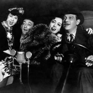 THEY ALL KISSED THE BRIDE, from left, Mary Treen, Allen Jenkins, Joan Crawford, Melvyn Douglas, 1942