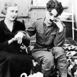 SHOULDER ARMS, from left: Edna Purviance, Charlie Chaplin, 1918
