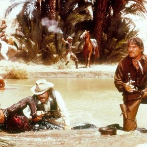 THE HUNTING PARTY, Candice Bergen (in water rear), Oliver Reed (white hat), L.Q. Jones (right), 1971