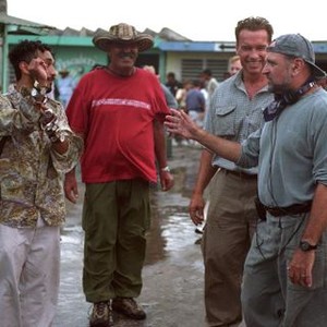 COLLATERAL DAMAGE, Christo Yanez, Salvo Basile, Arnold Schwarzenegger, director Andrew Davis taking time on the set, 2002 (c) Warner Brothers.  .