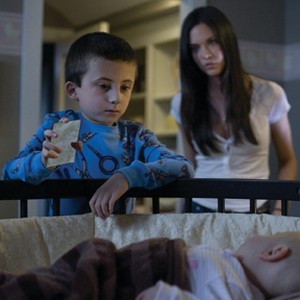 Atticus Shaffer as Matty Newton and Odette Yustman as Casey Belson in "The Unborn." photo 1