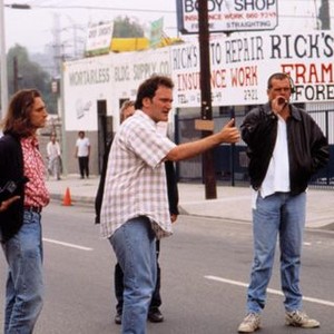 PULP FICTION, Quentin Tarantino (center) and Lawrence Bender (left) on location, 1994