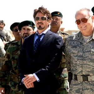 IRON MAN, foreground: Robert Downey Jr. (center), Bill Smitrovich (far right), 2008. ©Paramount