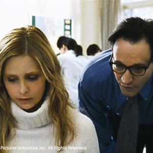 (L-R) Sarah Michelle Gellar as Karen and Ted Raimi as Alex  in "The Grudge." photo 15