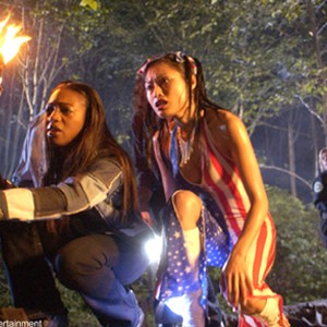 Karma (Enuka Okuma) and Liberty (Kira Clavell) investigate a gruesome scene in HOUSE OF THE DEAD