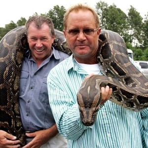 SNAKES ON A PLANE, snake handler Jules Sylvester, director David Ellis, on set, 2006, ©New Line Cinema