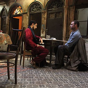 (L-R) Riz Ahmed as Changez and Liev Schreiber as Bobby Lincoln in "The Reluctant Fundamentalist." photo 10