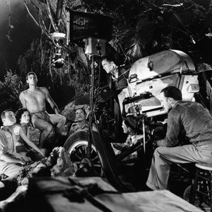 TARZAN AND HIS MATE, director Jack Conway, (behind camera) watches (from left) Neil Hamilton, Maureen O'Sullivan, Johnny Weissmuller, Paul Cavanagh, 1934