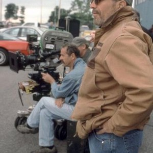 HEIST, foreground: director David Mamet, on set, 2001. © Warner Bros.