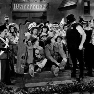 BABES IN TOYLAND, (aka MARCH OF THE WOODEN SOLDIERS), seated from left: Stan Laurel, Oliver Hardy, Henry Brandon (stovepipe hat), 1934