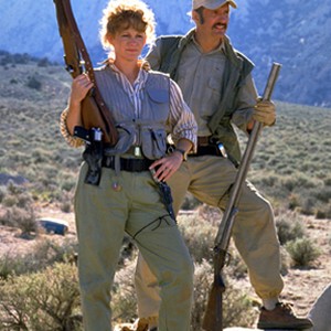 (L-R) Reba McEntire as Heather Gummer and Michael Gross as Burt Gummer in "Tremors." photo 4