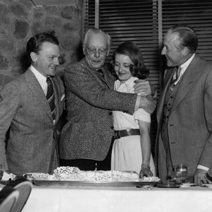 THE BRIDE CAME C.O.D., James Cagney, Harry Davenport, Bette Davis, director William Keighley, celebrating Davenport's birthday, on-set, 1941