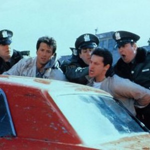 LOCK UP, in custody from left: Sylvester Stallone, Sonny Landham, 1989, © TriStar
