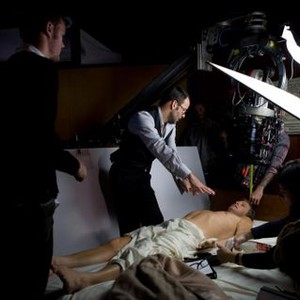 A SINGLE MAN, director Tom Ford (second from left), Colin Firth (lying down), on set, 2009. ph: Eduard Grau/©Weinstein Company