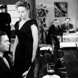DEADLINE AT DAWN, Marvin Miller (at piano), Susan Hayward (standing front), at table from left: Paul Lukas, Joseph Calleia, Bill Williams, Jerome Cowan, 1946