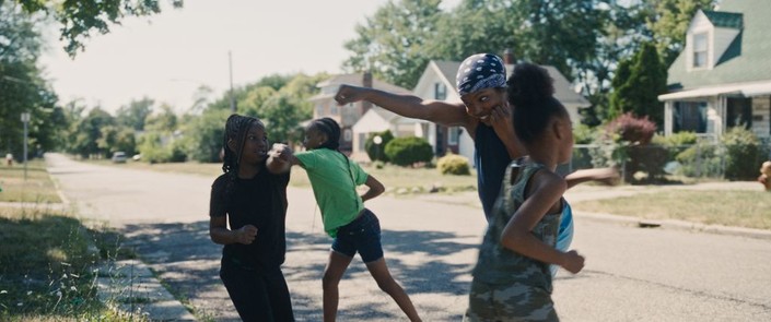 Claressa Shields (Ryan Destiny, second from right) inspires the neighborhood kids, in "The Fire Inside." (Amazon MGM Studios)