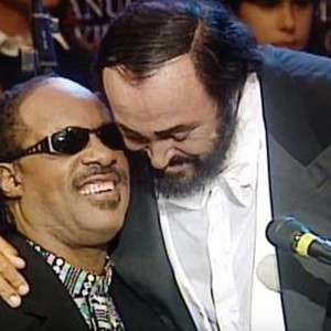 PAVAROTTI, FROM LEFT: STEVIE WONDER, LUCIANO PAVAROTTI AT THE 4TH WAR CHILD CONCERT, JUNE 10, 1998, MODENA, ITALY, 2019. © CBS FILMS