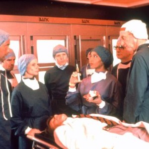 BRITANNIA HOSPITAL, Jill Bennet (third left), Malcolm McDowell (lying down), Marsha A. Hunt, Craham Crowden, 1982, (c) United Artists Classics