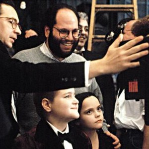 THE ADDAMS FAMILY, Director, Barry Sonnenfeld, Producer, Scott Rudin, watch a scene on the monitor with Christina Ricci and Jimmy Workman, 1991.