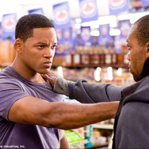 A would-be thief (Aaron Toney) is confronted by Will Smith (left), who stars as Hancock, a disgruntled, conflicted, sarcastic, and misunderstood superhero in "Hancock." photo 2
