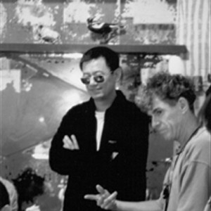 (L to R) Director Wong Kar-wai discusses a scene with co-cinematographer Christopher Doyle on the set of the film. photo 19