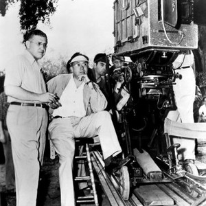 DUEL IN THE SUN, producer/screenwriter David O. Selznick (left), director King Vidor (sitting, right of Selznick), on set, 1946