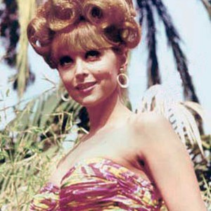 Tina Louise as Ginger Grant
