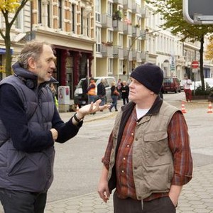 A MOST WANTED MAN, from left: director Anton Corbijn, Philip Seymour Hoffman, on set, 2014. ©Roadside Attractions