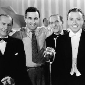 WAKE UP AND LIVE, from left, Ben Bernie, director Sidney Lanfield, Walter Winchell, Jack Haley, 1937, ©20th Century-Fox Film Corporation, TM & Copyright