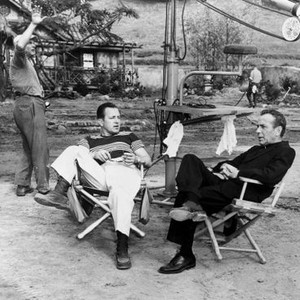 THE LEFT HAND OF GOD, Edward Dmytryk (director), Humphrey Bogart (dressed as priest), 1955, on-set