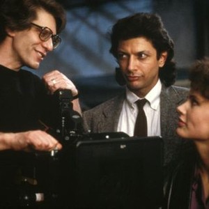 THE FLY, director David Cronenberg, Jeff Goldblum, Geena Davis on set, 1986, TM & Copyright (c) 20th Century Fox Film Corp.