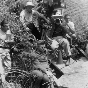 NORTHWEST PASSAGE, Robert Young (seated in sunglasses), director King Vidor (seated in jacket) on set, 1940