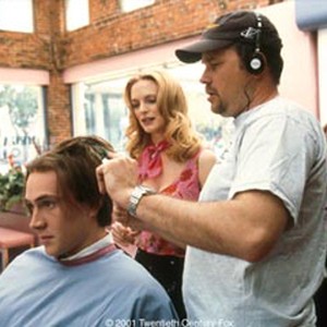 On the set of SAY IT ISN'T SO, director J.B. ROGERS shows HEATHER GRAHAM the proper way to give a really bad haircut to CHRIS KLEIN. photo 4